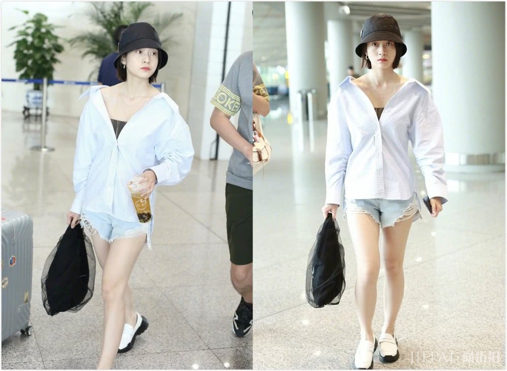 张雪迎机场街拍，穿大V领衬衫配牛仔短裤少女感十足